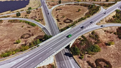 Road intersection with multiple routes in sunny weather Stock Footage 347751585