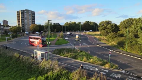 Road intersection, red double decker driving on road Stock-Footage 164808549