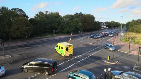 Road intersection in suburbs and ambulance car with siren lights Stock-Footage 164811852