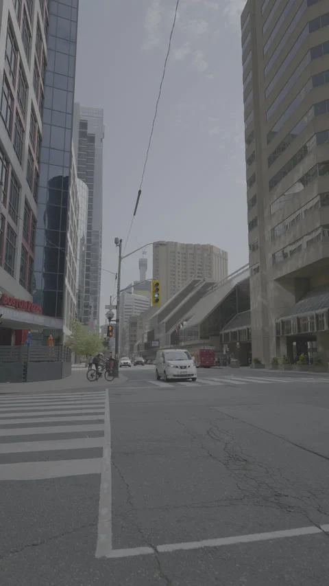 Road intersection with traffic lights in downtown Toronto, v-log 4k vertical Stock Footage 282053793