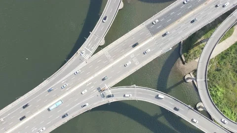 Road junction and bridge on river in the city, aerial view. Stock Footage 163441550