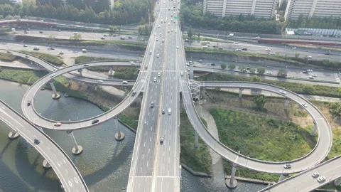Road junction and bridge on river in city, aerial view. Stock Footage 163934817