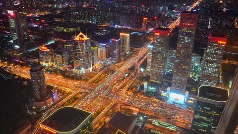 Road junction highway night illumination. Financial District. City road traffic  Stock Footage