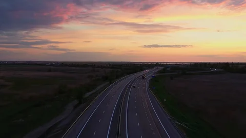 Road junction at sunset from above, highway in the steppe Stock Footage 129604559
