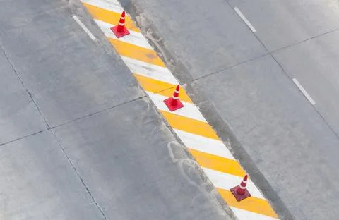 Road lane with traffic lines concrete White and yellow and  red traffic cone  Stock Photos