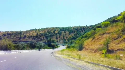 The Road leads in mountains high 1 Stock Footage 79916306