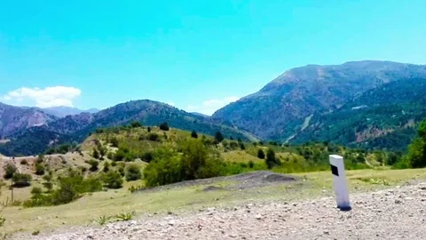 The Road leads in mountains high. Stock Footage 79950279