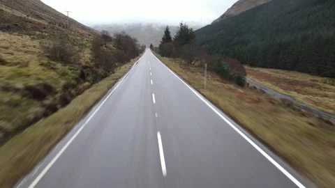 Road level rising to height in Scottish highlands Stock Footage 337000184