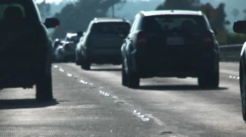 Road level traffic shallow focus Stock-Footage 7727879