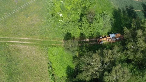 Road leveling grader tractor on bad rural road at work, aerial 스톡 동영상 124701123