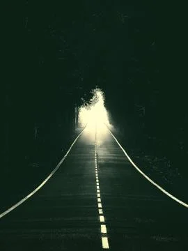 Road with light at the end Stock Photos