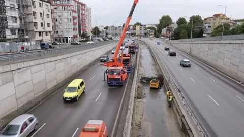 Road maintenance construction work on busy urban highway 動画素材 346723146
