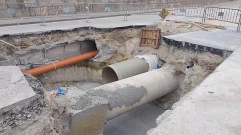Road maintenance excavation for sewer pipe installation Stock Footage 342348002