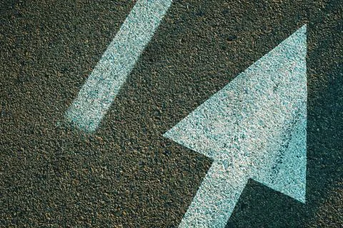 Road marking direction arrow on asphalt surface 스톡 사진