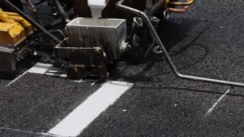 Road marking machine painting white line with heated paint on road asphalt bend Stock Footage 268566599