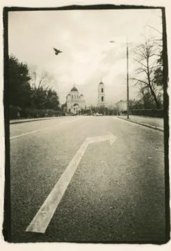 Road marking: a turn indicator on the background of the temple. Stock Photos