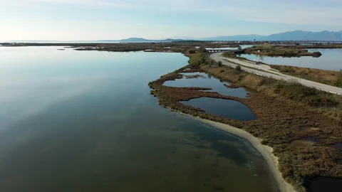 Road in the middle of the lake Stock Footage 141998553