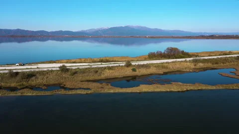 Road in the middle of the lake Stock Footage 141998592