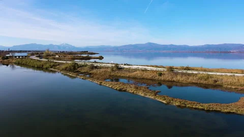 Road in the middle of the lake Stock Footage 141998637