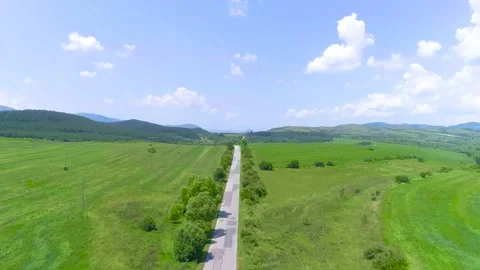 A road in the middle of a meadow Stock Footage 137155500