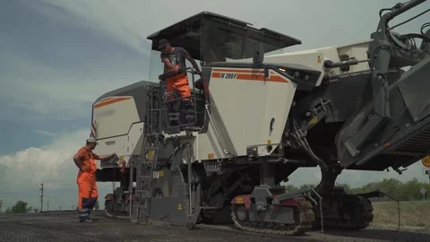 Road milling machine cuts old asphalt on the way Stock Footage 145466052