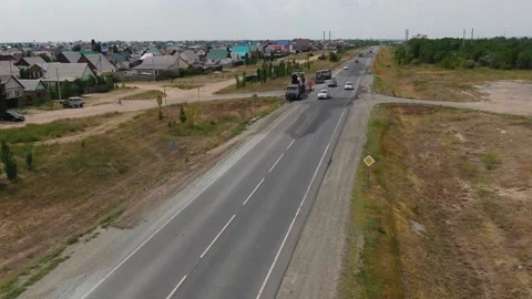 A road milling machine cuts old asphalt and loads it into a dump truck. Stock Footage 145466088