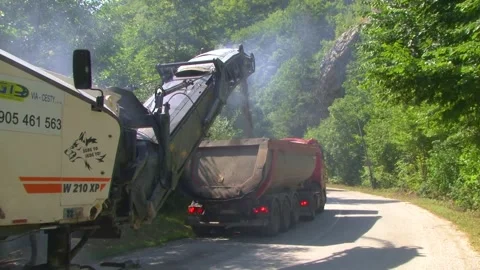 Road Milling Machine Loading Milled Asphalt Into Dump Truck Stock-Footage 344396322