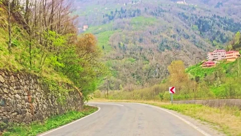 A road with a mountain in the background Stock Footage 272700246