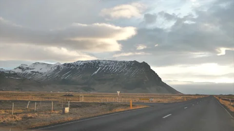 A road with a mountain in the background Stock Footage 301789990