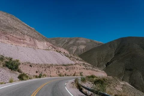 A road with a mountain in the background Stock Photos