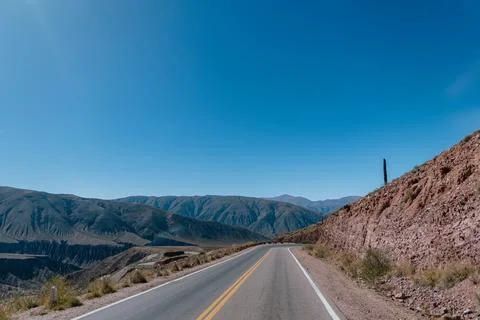A road with a mountain in the background Stock Photos