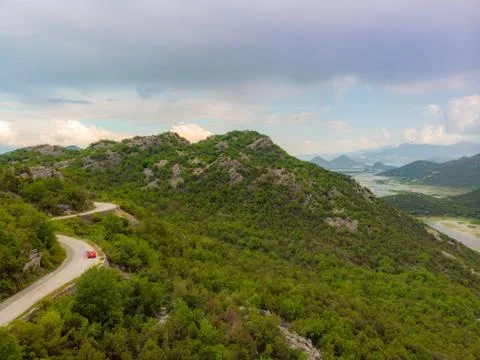 Road to the mountain. Beautiful Summer Mountain Road. Stock Photos