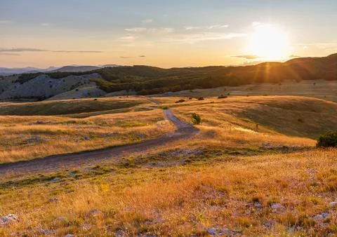 Road in mountain fields Stock Photos