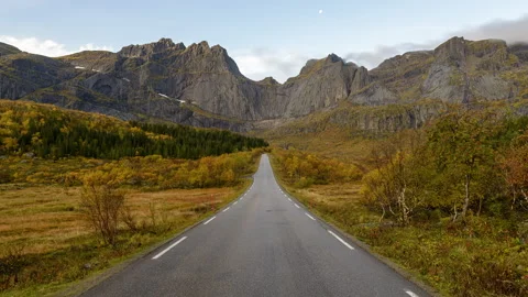 Road with a mountain ridge in the background Stock Footage 250437361