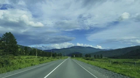 A road in a mountain valley among alpine meadows. 動画素材 317501481