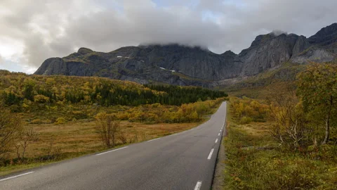 Road with mountains in background Stock Footage 250438001