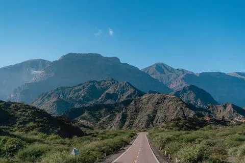 A road with mountains in the background Stock Photos