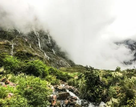 Road in the mountains with clouds Stock Photos