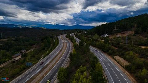 Road to the mountains from drone view. Stock Photos