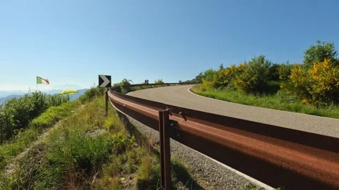 Road in the mountains with motorcycle Stock Footage 246792663