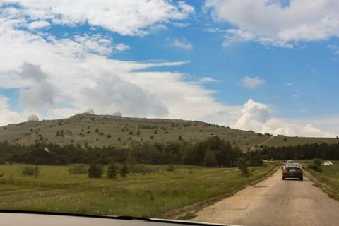 The road to the mountains. Stock Photos