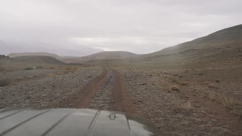 Road in the mountains shot through the windshield of the car Stock Footage 92974079