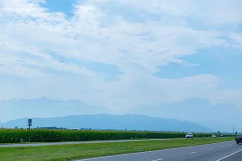 Road to the mountains in summer and blue sky Stock Photos