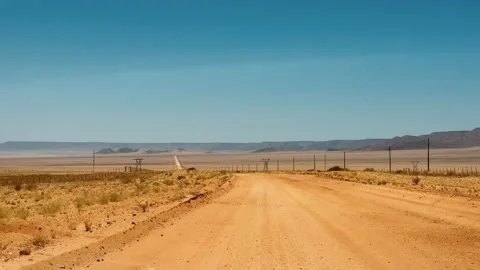 A road in Namibia on a clear, dry, sunny day	 Видео 333107439