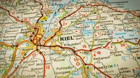 Road network leading to Kiel, Germany – gliding over atlas map Stock Footage 346188237