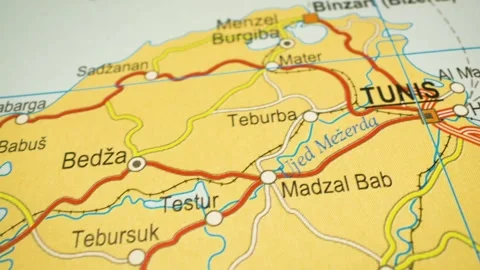 Road network leading to Tunis, Tunisia – gliding over atlas map Video stock 345385366