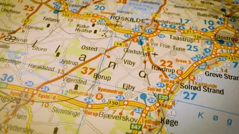 Road network to roskilde, denmark, gliding macro view over atlas map Stock Footage 341269540
