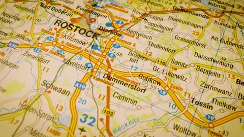 Road network to Rostock, Germany, gliding macro view over atlas map Stock Footage 341269550