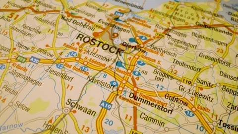 Road network to Rostock, Germany, gliding macro view over atlas map Stock Footage 341269815
