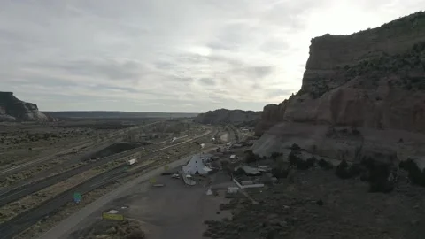 A road next to rock formation from a drone Vídeos de archivo 161813671